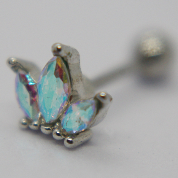 Close-up of a silver stud earring with three iridescent aqua marquise stones arranged like a small crown.