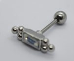Silver barbell jewelry with round back and small beaded ends flanking a rectangular blue-accented front on white.