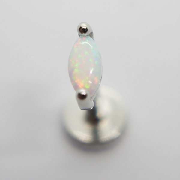 Marquise opal stud earring showing iridescent flashes, set in a small silver prong post on a gray background.