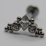 Silver stud earring with a central marquise-cut clear gem flanked by two round clear stones and small metal bead accents.
