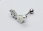 Silver barbell ear piercing with a small pearl, carved white flower bead and two clear gemstones on a white background.
