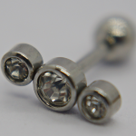 Stainless steel barbell earring with three bezel-set clear rhinestones, macro close-up on a light background.