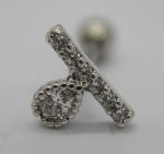 Close-up of a silver stud earring featuring a beaded-set round clear gemstone and a diagonal pavé bar of small stones