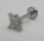 Small silver labret stud earring with flat circular back and star-shaped decorative front on white background