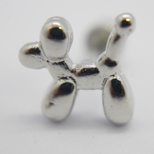 Close-up of a shiny silver balloon-dog shaped stud earring on a white background.