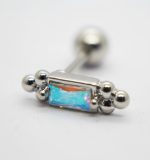 Silver barbell piercing with a rectangular iridescent opal-like stone flanked by small silver beads on a white background.
