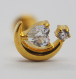Gold crescent earring stud holding a larger faceted clear gem and a smaller star-shaped setting with a tiny crystal.
