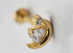 Gold crescent-shaped stud earring set with a triangular clear gemstone and a small round stone accent.