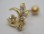 Gold crescent stud earring set with marquise and round clear stones in prong settings, shown in a macro close-up.