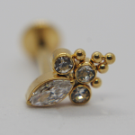 Gold stud earring with a marquise-cut crystal, three round clear stones and tiny gold beads on a white background.