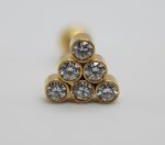 Six round clear gemstones set in gold bezel settings arranged in a triangular stack on a white background.