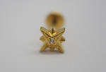 Gold star-shaped stud earring with a small central diamond resting on a white background.