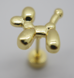 Gold metallic balloon-dog shaped stud earring on a post with a smooth glossy surface against a pale background