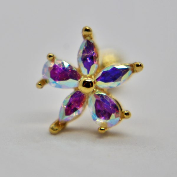 Gold flower stud earring with six iridescent purple-blue marquise stones and a central gold bead on a plain white background.