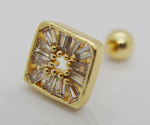 Gold square stud earring with radial baguette crystals surrounding a central ring of small gold beads on a white background.