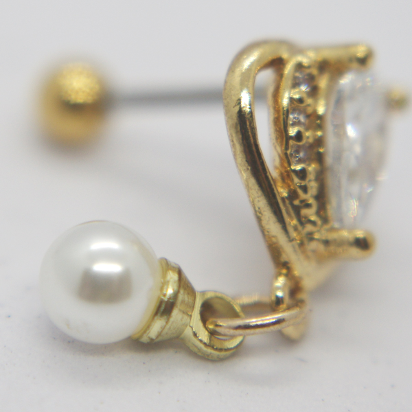 Gold stud earring with a faceted clear gemstone in a prong setting and a small dangling white pearl