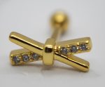 X-shaped gold stud earring with six small clear round stones set along the crossed arms, shown with a blurred screwback.