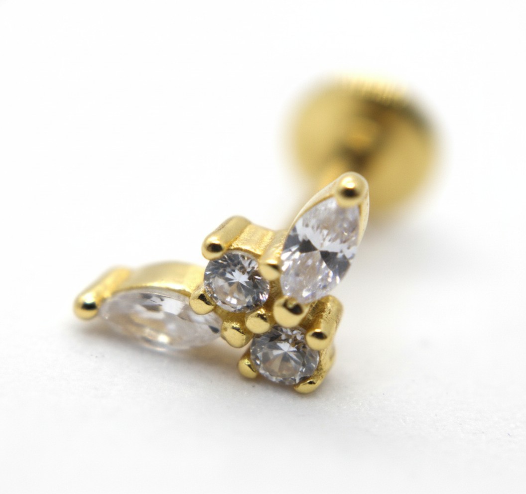 Gold stud earring with small round and marquise clear gemstones clustered, shown in a close-up on a white background.