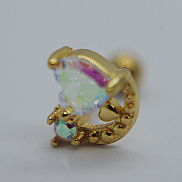 Small gold crescent earring stud with an iridescent opal-like stone and a smaller round opal on a white background.