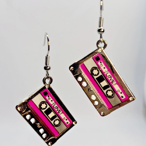Dangling earrings shaped like retro pink cassette tapes with silver hardware and hooks.