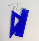 Pair of blue translucent acrylic ruler and triangle earrings with silver hooks and visible measurement markings on a white background.