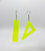 Pair of neon yellow plastic ruler-style earrings — one rectangular ruler and one triangular set-square — dangling from silver hooks on a light gray background.