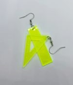 Neon yellow translucent plastic earring charms shaped like a ruler and triangle with metal fishhook wires on a white background.