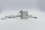 Silver book locket pendant on a chain engraved "For all those who found themselves in books," on a white background.