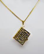Gold book-shaped locket pendant on a gold chain, engraved with decorative border and the inscription For all those who found themselves in books.