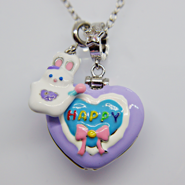 Purple heart pendant with blue center reading HAPPY in rainbow letters, pink bow and white bunny charm on silver chain