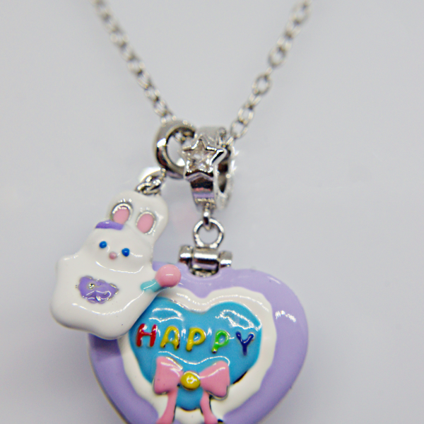 Silver chain with purple heart pendant showing a blue inner heart reading HAPPY, pink bow, and small white bunny charm.