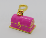 Small pink enamel treasure-chest keychain with gold trim, latch, and lobster-claw clasp.