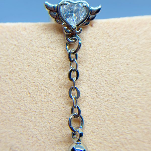 Heart-shaped crystal stud with silver wings and a dangling chain ending in a bead